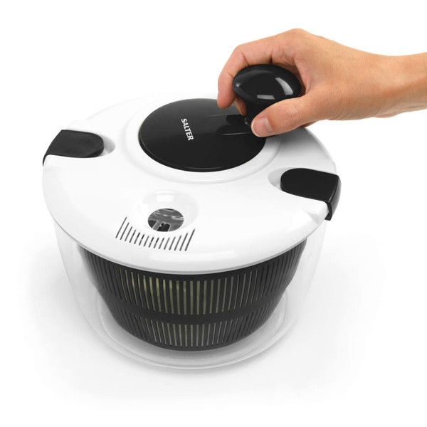 Salter salad spinner with black and white lid, shown in use