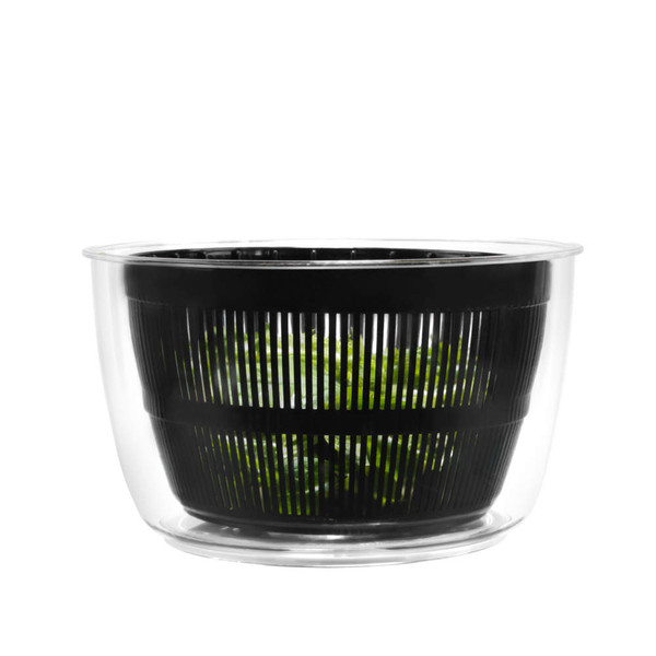 Black salad spinner with clear bowl, shown with green salad leaves inside