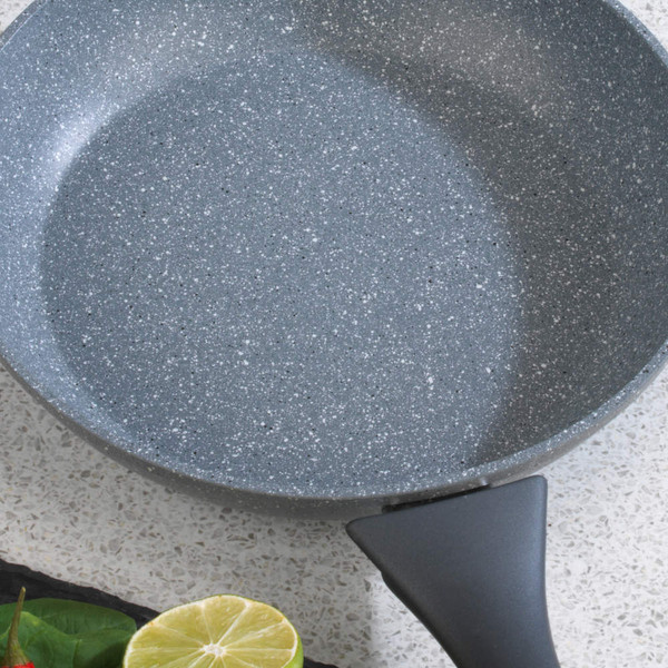Grey non-stick frying pan with speckled finish, shown from above on worktop