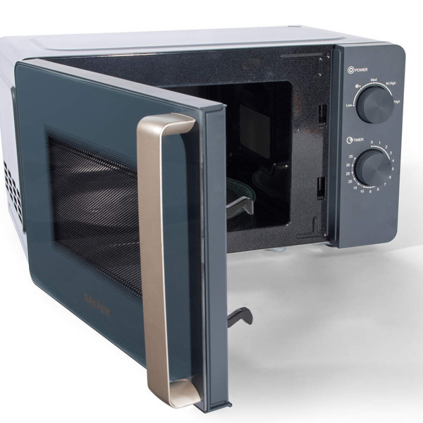 Grey microwave oven with gold handle, door open, showing manual dials