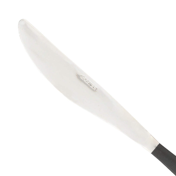 Stainless steel butter knife with black handle, shown blade detail.