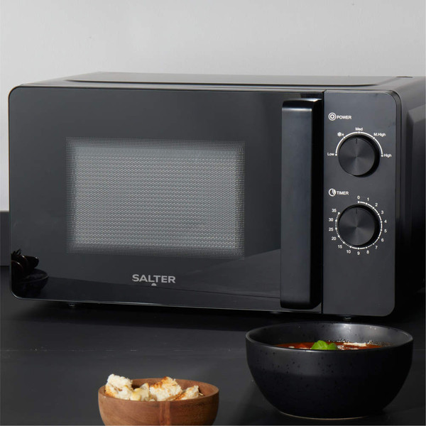 Black Salter kettle, glass cup with tea bag, and toaster on kitchen worktop
