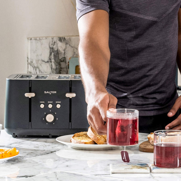 Black Salter 4-slice toaster on kitchen counter, with toast and tea being served.