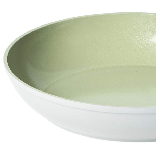 Large shallow bowl with light green interior and white exterior, shown from side angle