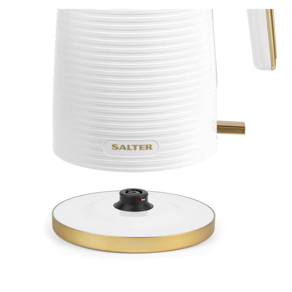 White cordless kettle base with gold accents, partial side view