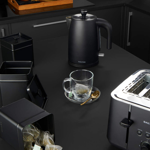 Black Salter electric kettle and toaster with tea canisters on black kitchen counter