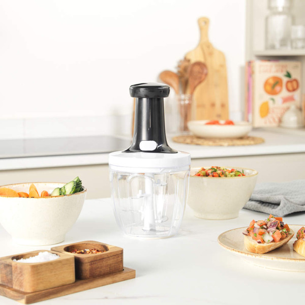 Salter manual food chopper and slicer set with clear bowls, shown on kitchen worktop