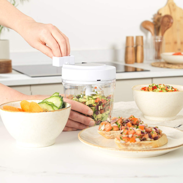 Salter pull chopper with white lid, shown with chopped vegetables inside, for easy food prep