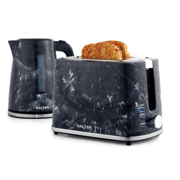 Black marble-effect electric kettle pouring hot water into a grey mug in a kitchen setting