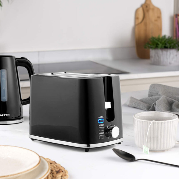 Black electric kettle with water level window, on kitchen counter