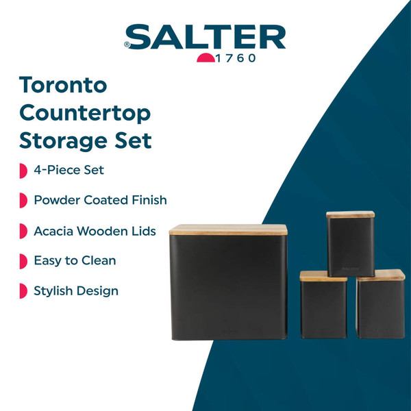 Kitchen set with black storage containers and wooden lids, loaf of bread visible.