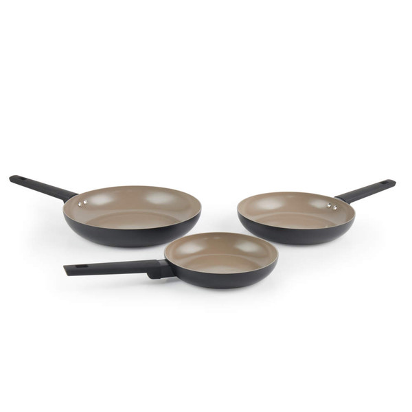Set of three black non-stick frying pans with beige interior, different sizes