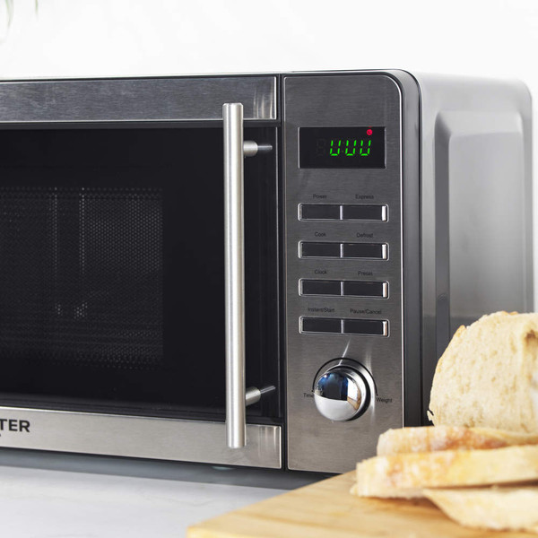 Silver microwave with open door and digital display, showing interior and control panel
