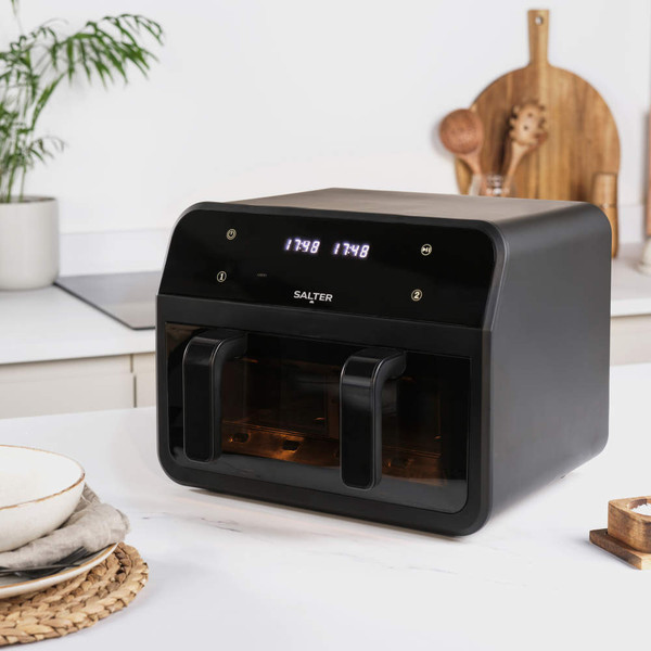 Black Salter dual air fryer on kitchen counter with digital display and two compartments