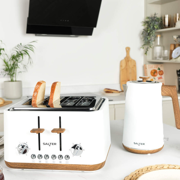White four-slice toaster with wood accents, shown from the front with crumb trays extended