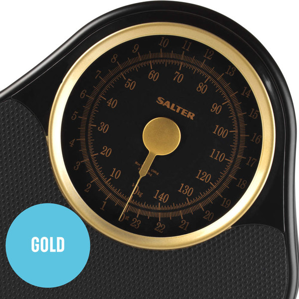 Gold and black analogue bathroom scales with Salter branding, close-up of dial