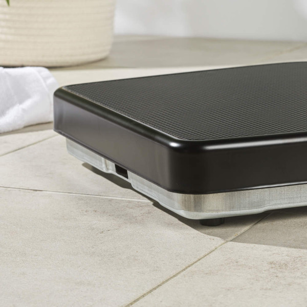 Mechanical bathroom scale with black textured platform and rose gold dial, shown upright