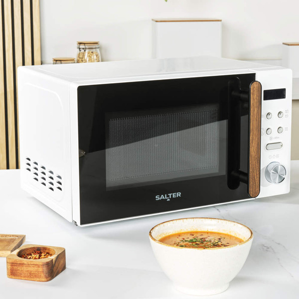 White and black Salter microwave oven with digital controls, angled front view
