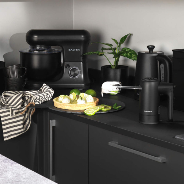 Kitchen countertop with Salter black stand mixer and hand mixer, lime tart and cups.