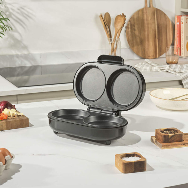 Electric breakfast maker with twin non-stick round plates on kitchen counter