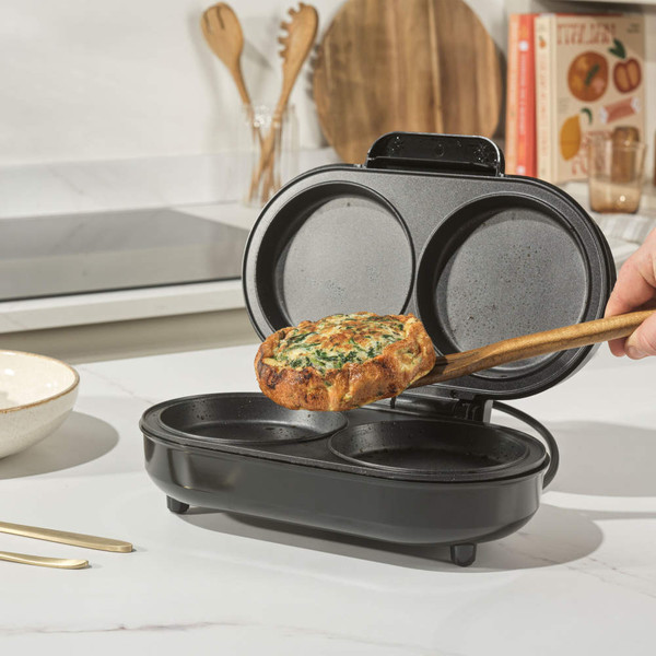 Electric breakfast maker with twin non-stick round plates on kitchen counter
