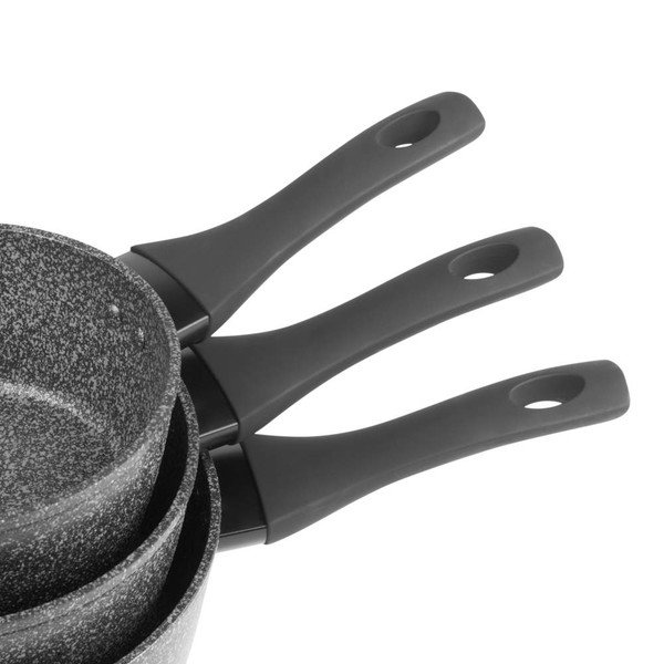 Set of three grey non-stick saucepans, stacked with black handles visible