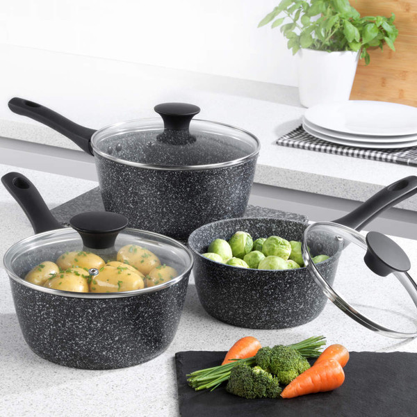 Set of three black speckled saucepans with glass lids, shown on kitchen worktop