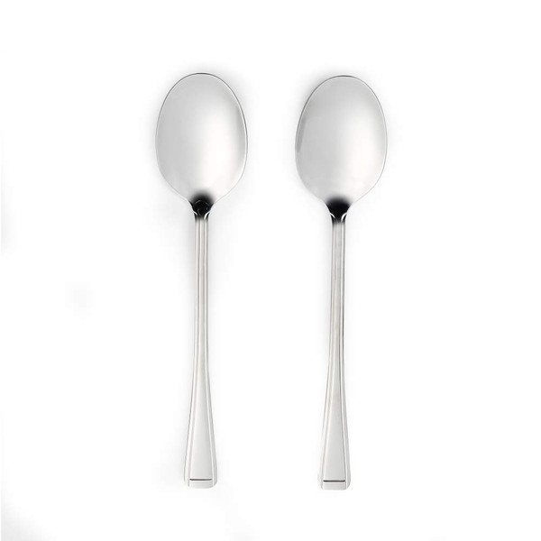 Pair of silver dessert spoons with straight handles on white background