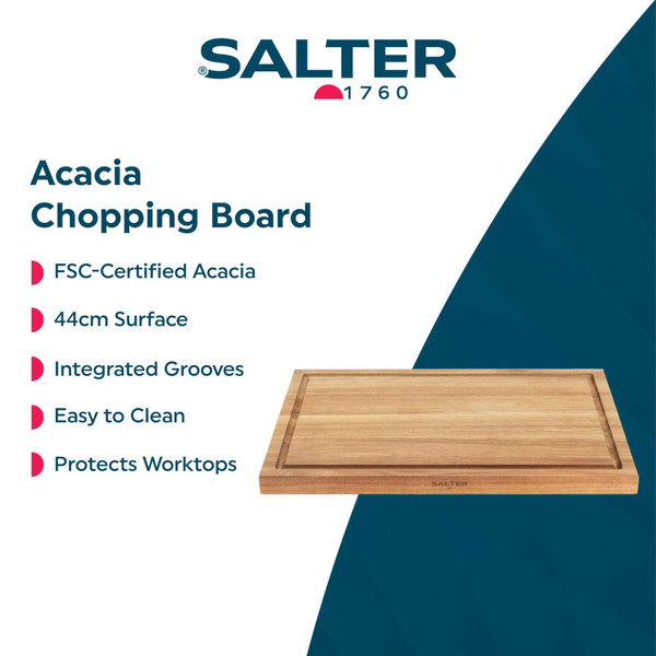 Sharing platter of assorted cheeses, crackers, fruit and cured meats on a wooden board