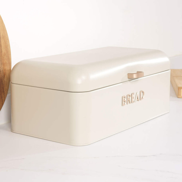 Cream bread bin with lid open, showing a rustic loaf inside