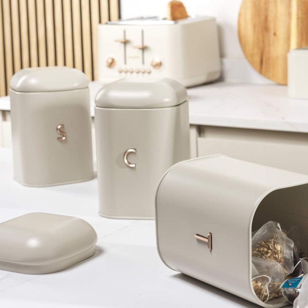 Cream kitchen set with kettle, toaster, bread bin, and storage canisters on worktop