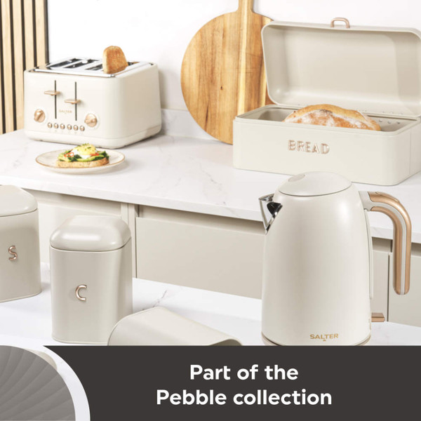 Cream kitchen set including kettle, toaster, bread bin, and storage jars on counter