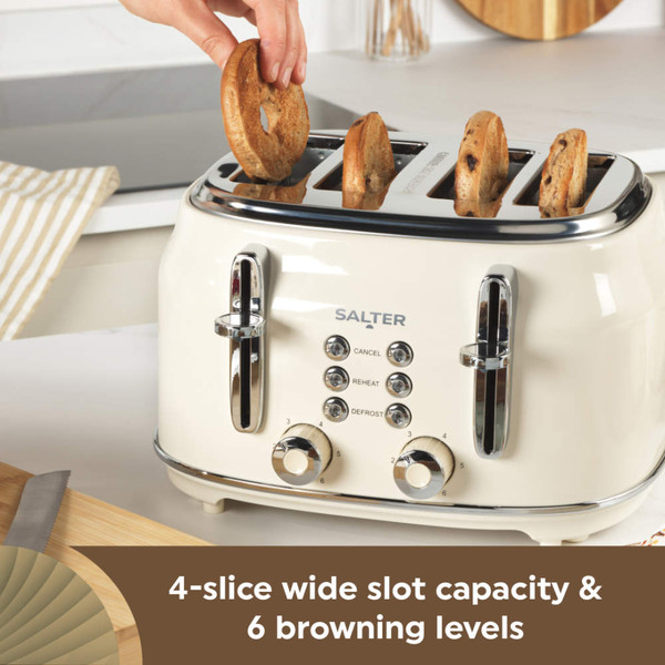 Cream toaster with two removable crumb trays, shown with some crumbs for cleaning feature