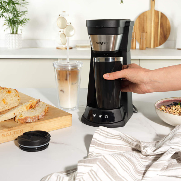 Black Salter coffee maker with insulated cup, on kitchen counter