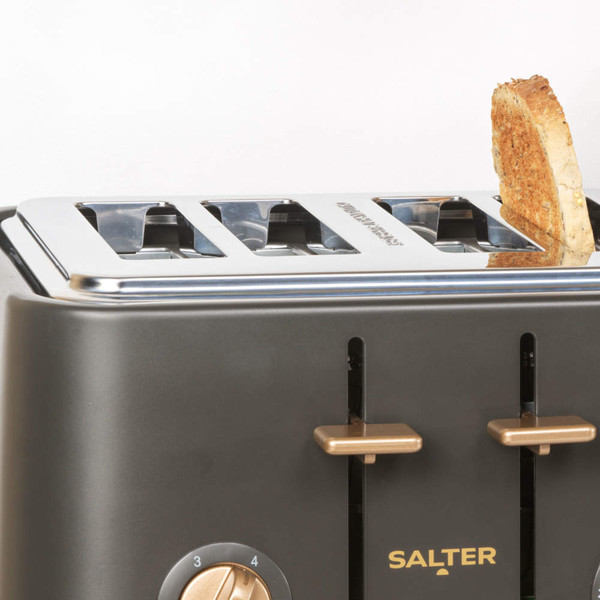 Black Salter 4-slice toaster with gold controls, showing a slice of toasted bread.