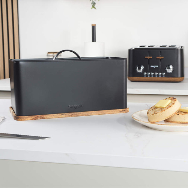 Black metal bread bin with handle and wooden base, shown from the front.