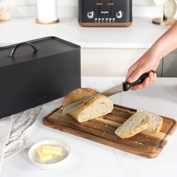 Black bread bin with handle on natural wood base, product listing image