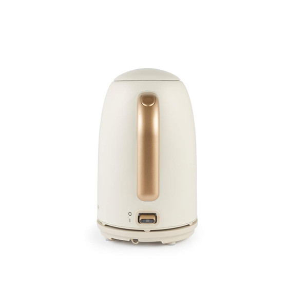 Cream electric kettle pouring hot water into grey mug, shown from side angle.