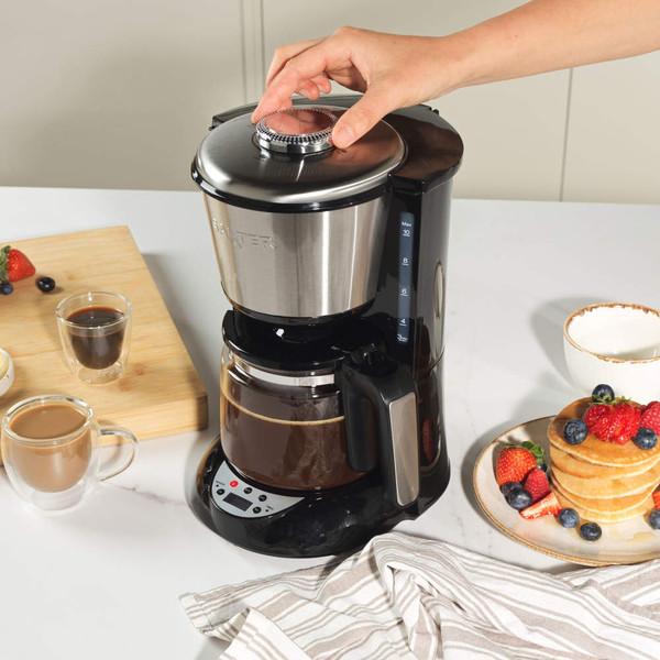 Salter filter coffee machine brewing coffee with breakfast pancakes and fruit nearby