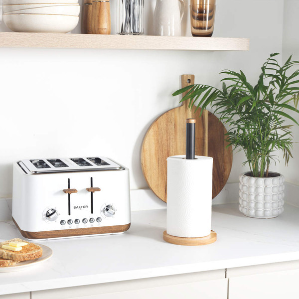 White four-slice toaster with wood accents on kitchen counter, next to paper towel holder