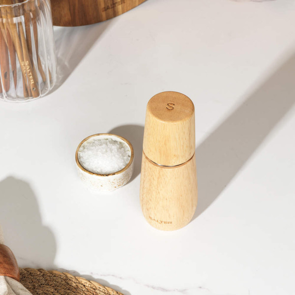 Wooden manual pepper mill showing ceramic grinding mechanism