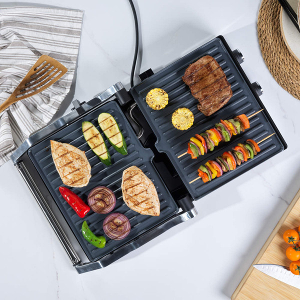 Stainless steel electric contact grill with open lid and dual temperature controls