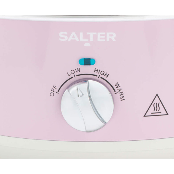 Close-up of pink Salter slow cooker heat control dial with off, low, high, and warm settings