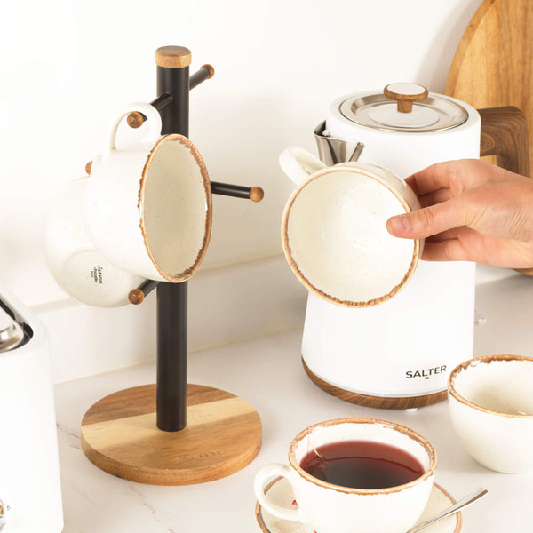 Black metal and wood kitchen mug tree stand on natural wood base