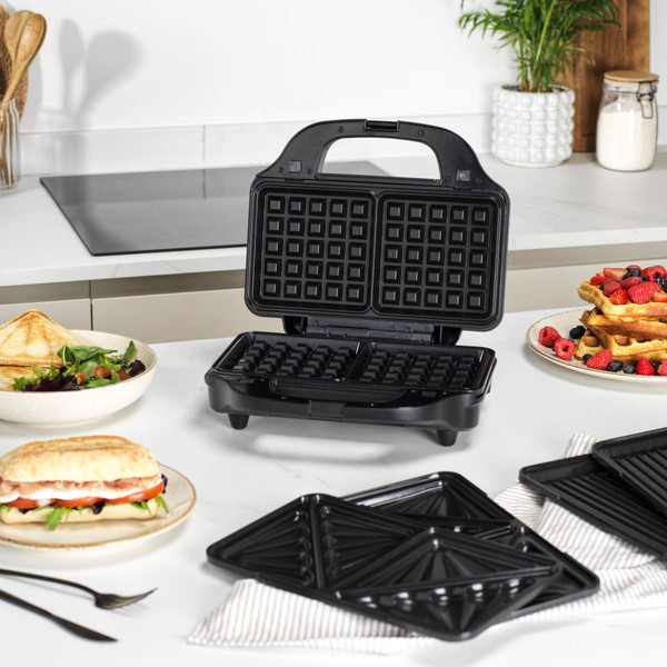 3-in-1 sandwich, waffle and grill maker with interchangeable plates, shown with food