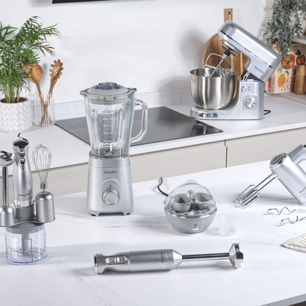 Range of silver Salter kitchen appliances on worktop, including blender, mixer and hand mixer.