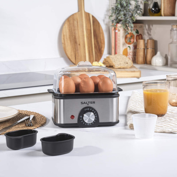 Silver electric egg cooker with accessories, shown disassembled on white background