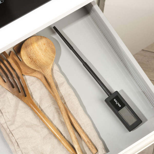Salter digital cooking thermometer in kitchen drawer beside wooden utensils