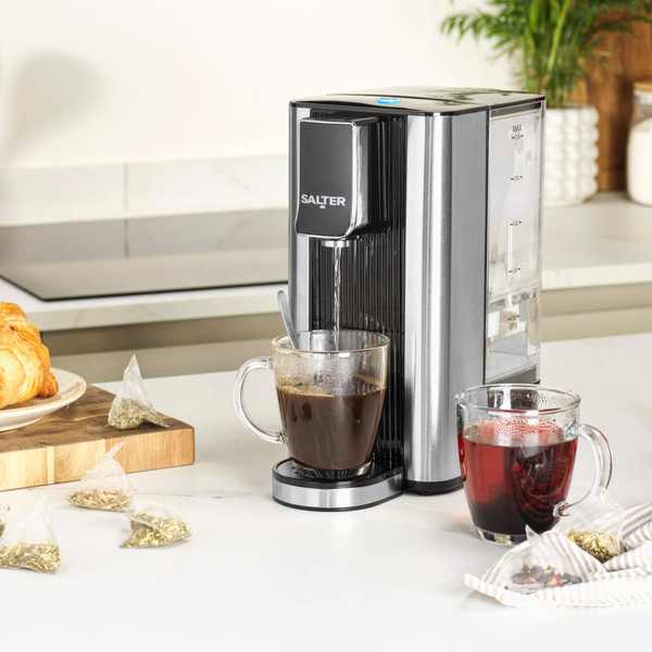 Black Salter hot water dispenser on kitchen counter with glass mug and herbal tea bags