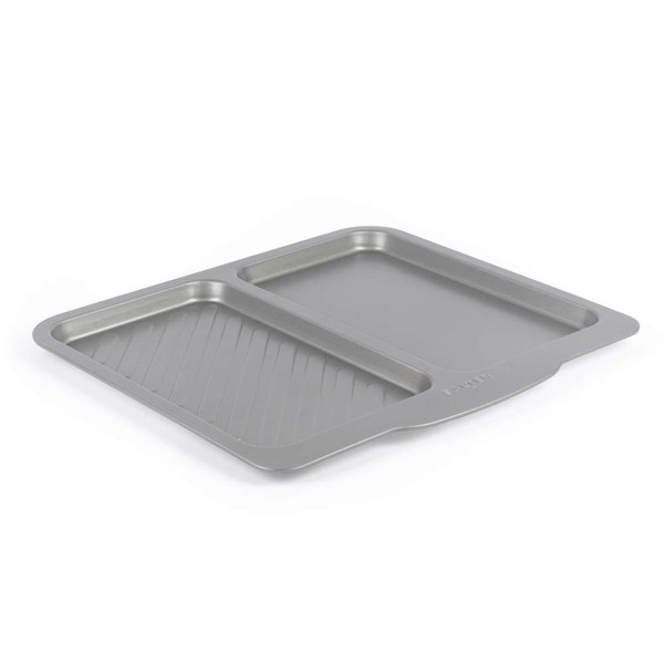 Grey non-stick oven tray with ribbed and flat sections, shown angled on white background